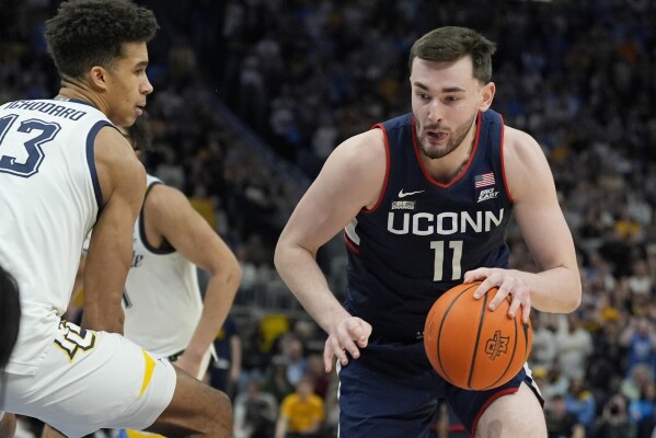 No. 2 UConn outlasts No. 8 Marquette 74 67 for 1st Top 25 road win